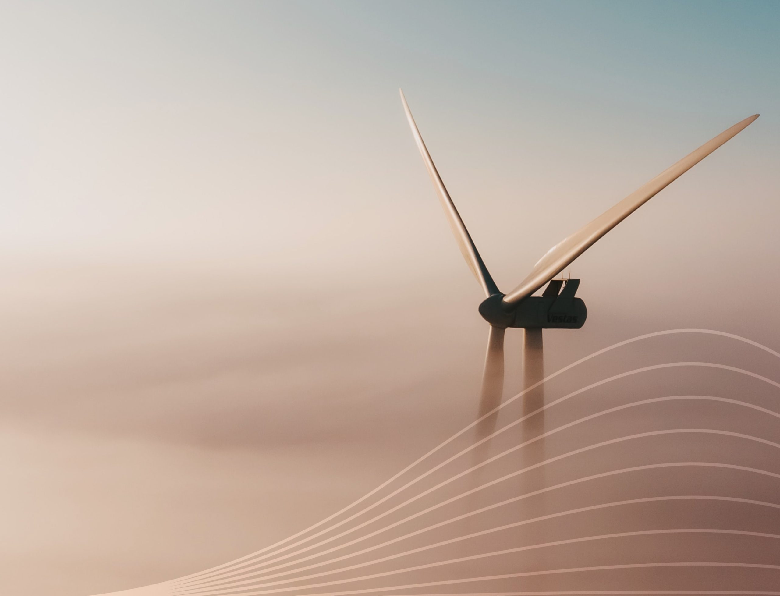 Une éolienne entourée de nuages